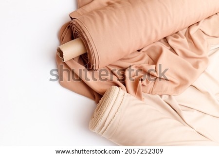Rolls of pastel color fabric isolated on white Royalty-Free Stock Photo #2057252309