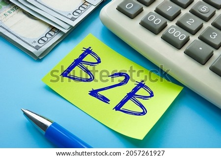 Financial concept meaning B2B business-to-business with sign on the page. 
