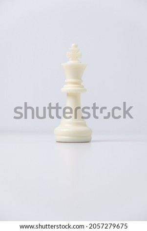 isolated white king chess piece on white background