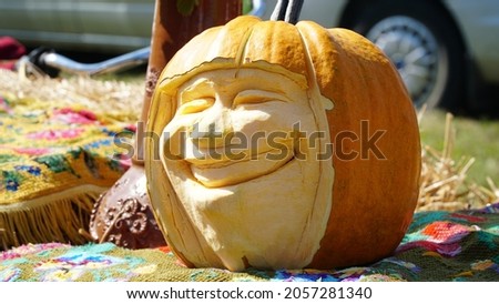 Pumpkin carving in the shape of a human head. Halloween pumpkin.