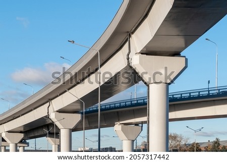 Automobile overpass on concrete supports. New road infrastructure. Preventing traffic jams Royalty-Free Stock Photo #2057317442