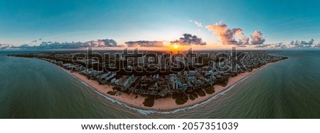 Panoramic view from sunset in the city and beach, drone image, brazil, João Pessoa. Beach, sun and city. 