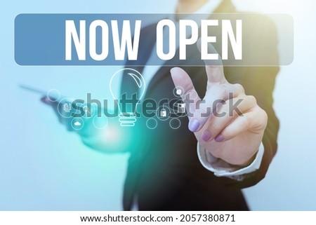 Hand writing sign Now Open. Business overview leave door or windows not closed or barred at this current time Woman In Uniform Carrying Phone And Tapping Futuristic Display.