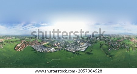Spherical panorama of land or landscape of green field in aerial view. Include agriculture farm, house building, village. That real estate or property. Plot of land for development, sale or investment