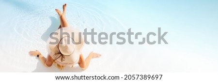 Panorama sized banner of woman relaxing on tropical beach, view from above Royalty-Free Stock Photo #2057389697