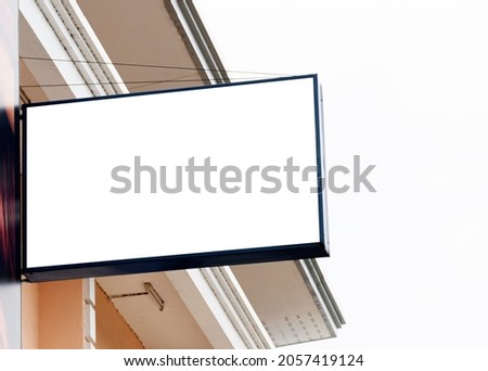 Billboard on building and blue sky background with white background mock up. clipping path