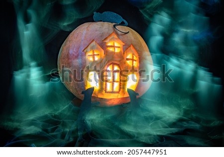 Halloween carved pumpkin castle with rat