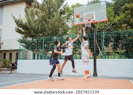 basketball player jumping with rebound position while playing