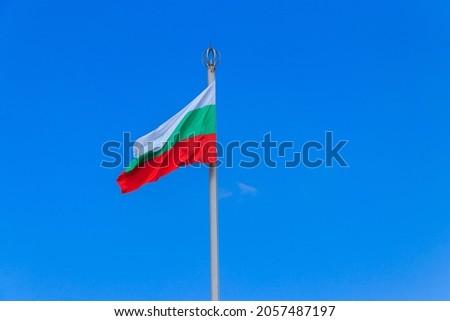 Waving flag of Bulgaria against blue sky