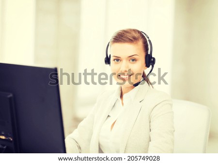 picture of friendly female helpline operator with headphones