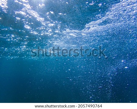 Underwater bubbles with sunlight. Underwater background bubbles, Air bubbles underwater rising to water surface, natural scene, Mediterranean sea, Underwater with bubble. Great for backgrounds.