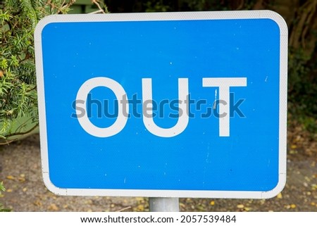 Sign post that says OUT