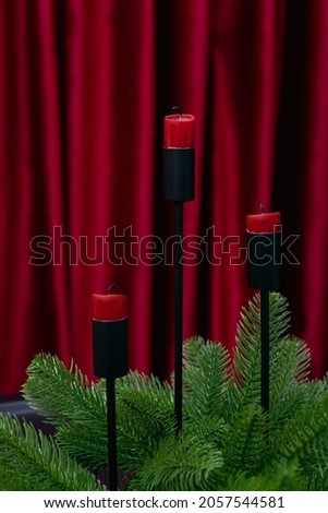 Advent red candles with christmas decoration . High quality photo
