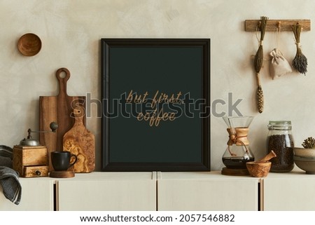 Stylish composition of modern kitchen interior design with mock up poster frames, beige sideboard and retro accessories. Template. Autumn vibes.