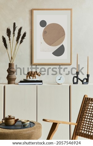 Creative and modern beige living room interior composition with mock up poster frame, beige wooden sideboard and boho inspired accessories. Template.