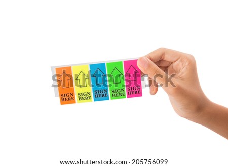 Female teenager hand holding colorful stick it SIGN HERE arrow tag over white background