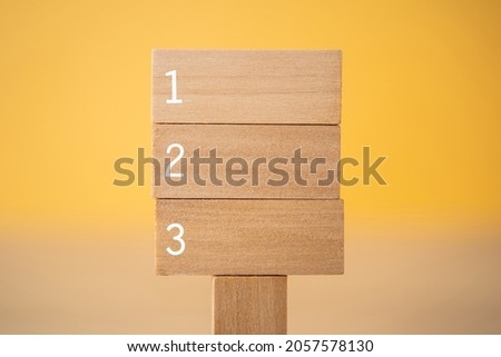 Three wooden signboard with "123" text. Royalty-Free Stock Photo #2057578130