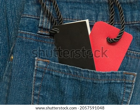 Clothes tag in a jeans pocket. Black Friday Sale or Discount banner. Modern minimal design with space for text. Template for promotion, advertising, web, social and fashion ads. High quality photo