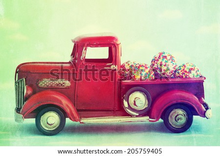 Old antique toy truck carrying sweet candy