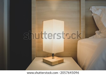 Interior photography of a modern style bedroom hotel side tables and lamps