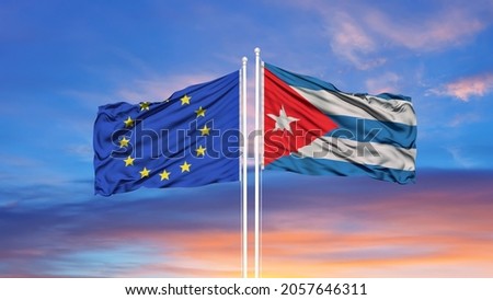 European Union and Panama two flags on flagpoles and blue cloudy sky