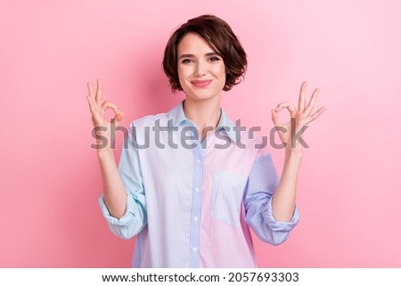 Photo of young woman happy positive smile show okay alright perfect choice ad sign isolated over pink color background