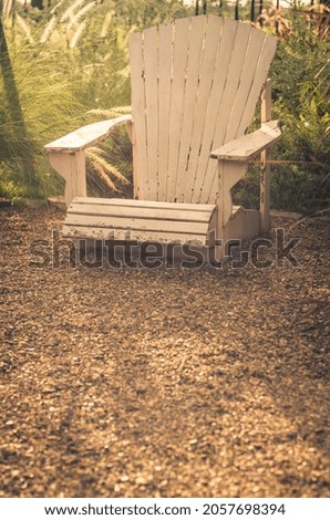 Beautiful white wooden  bench in country garden