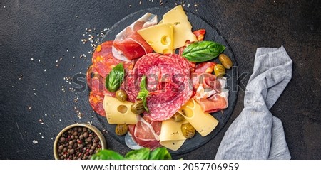 snack plate meat, sausage, cheese, ham, olives fresh meal appetizer on the table copy space food background  Royalty-Free Stock Photo #2057706959