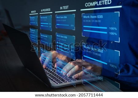 Agile software development with developer using Kanban board framework methodology on computer. Devops team, lean project management tool for fast changes, incremental work, iterative process. Royalty-Free Stock Photo #2057711444