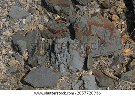Sample of natural shale sedimentary rock. Shale is a fine-grained sedimentary rock that forms from the compaction of silt and clay-size mineral particles that we commonly call mud. Royalty-Free Stock Photo #2057720936