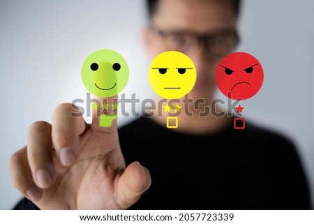 Businessman pressing smiley face touch screen. Business Service Satisfaction concept Royalty-Free Stock Photo #2057723339
