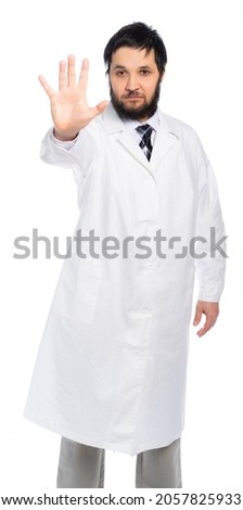 A bearded doctor in a white coat, in a medical uniform, shows an open palm, a stop sign, stop. isolated. White background