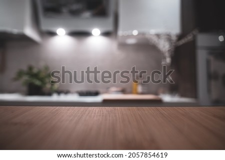 Wooden table top on blur kitchen room background. For displaying the assembly product or visual arrangement of the configuration keys Royalty-Free Stock Photo #2057854619