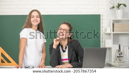 mom and daughter use pc. back to school. childhood education online.