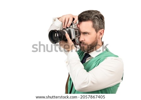 male photographer. copy space. man photographing. guy holding photo camera.