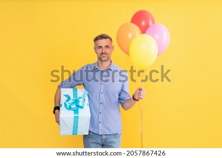 happy birthday holiday. black friday discount. seasonal sales. man with box and party balloons