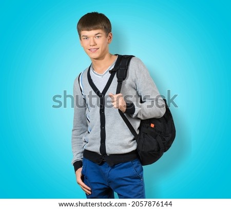 Young boy teen student wear casual clothes and backpack posing