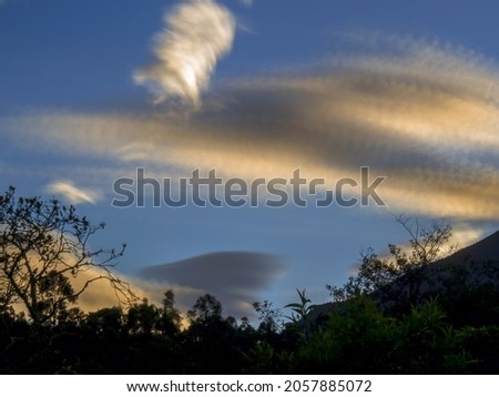 Multiple exposure of some clouds at sunrise over the central mountains of Colombia near the town of Villa de Leyva.