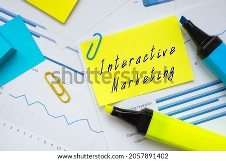 Financial concept meaning Interactive Marketing with sign on the page. 
