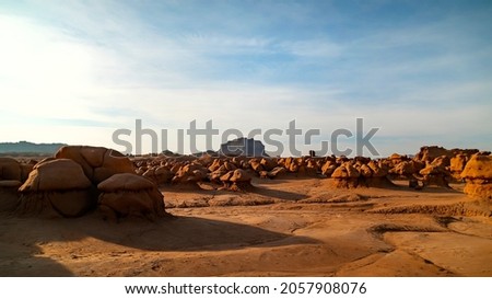 Gorgeous stunning shot of the beautiful Goblin Valley Utah State Park mushroom rock formations with space to walk between them on a week on a warm sunny summer day.