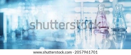 glass flask and beaker in medical health science of technology banner background Royalty-Free Stock Photo #2057961701