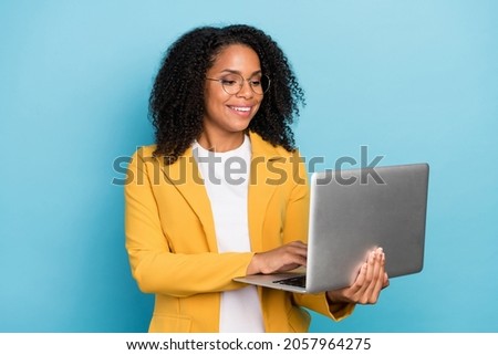 Photo of young black business woman happy smile type project report laptop isolated over blue color background