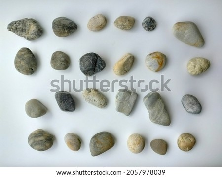 Pebble isolated, round stone rock isolated in white background