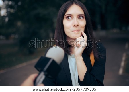 
Tv Journalist Interviewing a Woman on the Street. Woman being interviewed by a reporter in vox pop video format
 Royalty-Free Stock Photo #2057989535