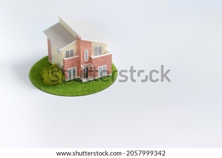 Plastic model house placed on the table (my home plan image) Royalty-Free Stock Photo #2057999342