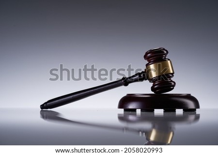 close up of gavel hammer on gray backgroun,law concept          