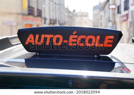 france driving school in france panel on car roof with text french auto ecole