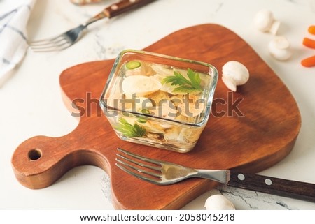 Bowl of tasty aspic on table