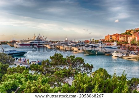View of the harbor with luxury yachts of Porto Cervo, Sardinia, Italy. The town is a worldwide famous resort and a luxury yacht magnet and billionaires' playground Royalty-Free Stock Photo #2058068267