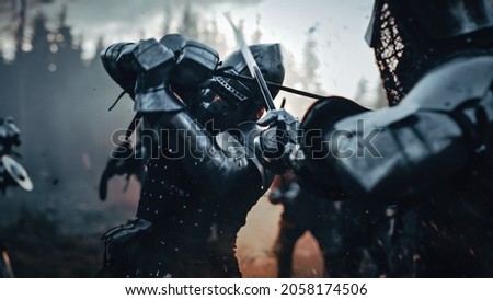 Medieval Knight Walking on Battlefield amidst Dead Enemies. Last Surviving Crusader, Soldier, Warrior after Battle. Destruction of War, Invasion, Crusade. Dramatic, Cinematic Historic Reenactment Royalty-Free Stock Photo #2058174506